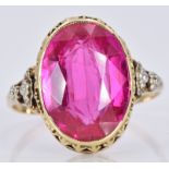 A 14k gold ring set with an oval synthetic ruby, 3.5g, size P/Q