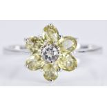 A 9ct white gold ring set with Mali garnets and white topaz in a flower cluster, 2.5g, size N