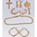 A group of 9ct gold jewellery including St Christopher, crucifix, three pairs of earrings and a