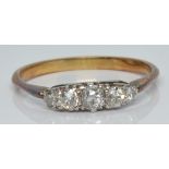 An 18ct gold ring set with five old cut diamonds, 2.9g, size R