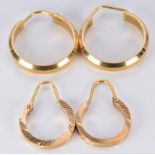 A pair of 18ct gold hoop earrings (4.2g) and a yellow metal pair (2.2g)