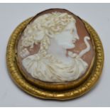 Victorian pinchbeck brooch set with a large cameo depicting Eros, 5.8 x 6.5cm