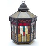 A stained and leaded glass hexagonal light shade, H33 x W23cm