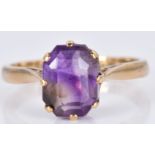 A 9ct gold ring set with an emerald cut amethyst, 2.6g, size K/L