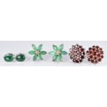 Three pairs of earrings set with garnets and emeralds