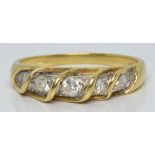 A 14k gold ring set with five diamonds, 3.0g, size M