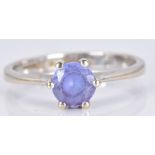 An 18ct white gold ring set with a round cut tanzanite, 3.1g, size M