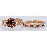 A 9ct gold eternity ring set with alternating garnets and pearls and a 9ct gold ring set with