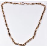 A 9ct rose gold Albert/ watch chain made up of unusual pierced oval links, maker ACCo, 24.5g