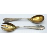 Pair of German white metal salad servers with gilt bowls, stamped 800, length 21cm, weight 159g