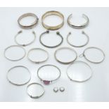 Twelve silver bangles with engraved decoration and two christening bangles, 178g