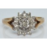 A 9ct gold ring set with diamonds in a cluster, 3.3g, size P