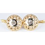 A pair of 18ct gold earrings set with paste, 6.3g
