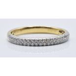 An 18ct gold wedding ring set with two rows of diamonds