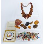 An amber necklace, copal amber, agate pebbles etc