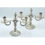 Pair of George VI hallmarked silver candelabra with removable central finials and knopped stems,