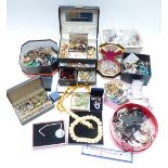 A collection of costume jewellery including beads, brooches, silver necklace, vintage earrings,