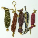 Five 19thC cut steel and embroidery purses with ornate bar clasps, longest 13cm