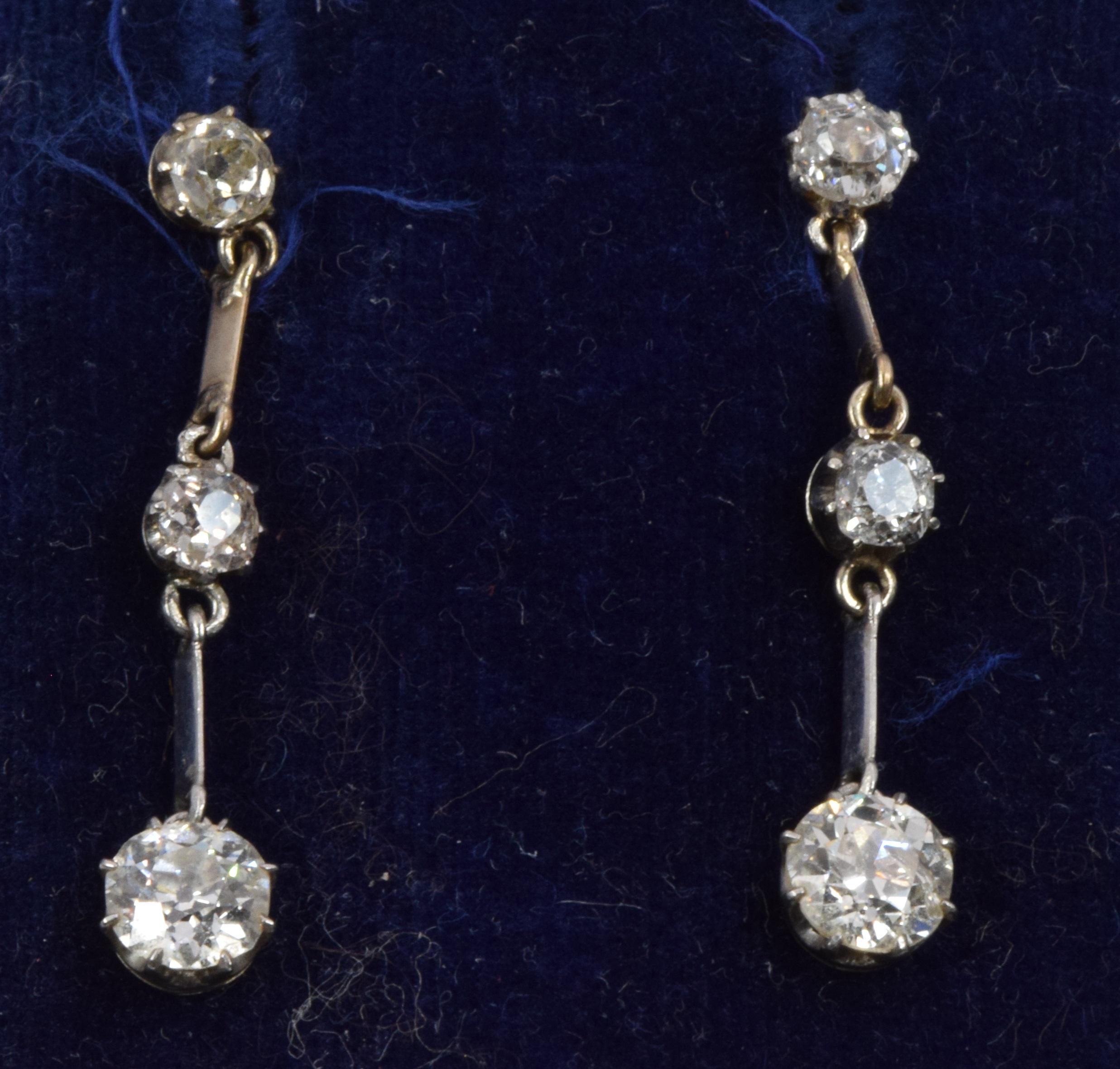 A pair of Art Deco 9ct white gold earrings set with three old cut diamonds, the largest - Image 4 of 4