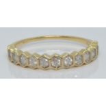 A 10k gold half eternity ring set with diamonds, with certificate, size T