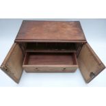 A 19th or early 20thC tile inset oak table top stationery cabinet with fitted interior and single