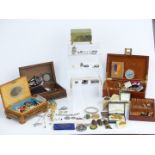 A collection of costume jewellery including badges, Cheltenham Festival of Music medals, pearls,