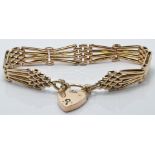 A 9ct gold gate bracelet with heart padlock, 15g