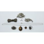 A silver necklace and earrings set with tiger's eye, silver brooch, marcasite, etc. 53.7g.