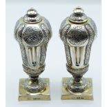 Pair of Victorian hallmarked silver gilt urns or peppers, London 1880, maker Robert Harper, height