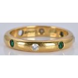 An 18ct gold eternity ring set with emeralds and diamonds, 4.3g, size M