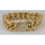 An 18ct gold curb link bracelet, length 20cm, 57.1g