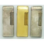 Two Dunhill Rollagas lighters and a similar petrol lighter