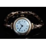 Swiss 9ct gold ladies wristwatch with blued hands, black Arabic numerals, gilt minute markers, white