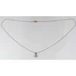 An 18ct gold pendant set with a diamond of approximately 0.45ct on a 9ct gold chain