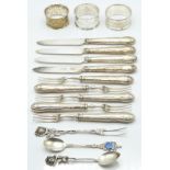 Cake knives and forks with hallmarked silver handles, continental white metal spoon and fork with