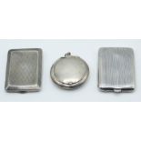 Two hallmarked silver match cases, Birmingham 1926 and 1928 and a small hallmarked silver compact,