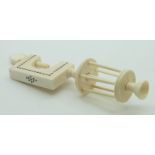 A 19thC Indian Madras ware ivory sewing / needlework pin cushion clamp with winder, height 14cm