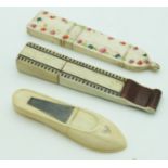Three Georgian bone/ivory needle cases including a shoe with cut steel decoration, longest 8cm