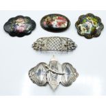 Russian Niello white metal belt buckle, three lacquer brooches and a paste belt buckle. 67g.