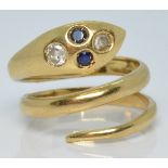 An 18k gold snake ring set with two round cut sapphires and two round cut diamonds, 7.2g, size L