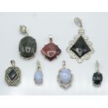 Seven silver pendants including set with rutile quartz, onyx, marcasite, obsidian and blue lace