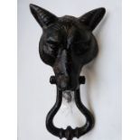 A vintage cast iron fox mask door knocker and stop, height 24.5cm.