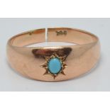 A 9ct rose gold ring set with faux turquoise, 2.5g