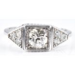 Art Deco platinum ring set with a diamond of approximately 0.7ct and three futher diamonds to each
