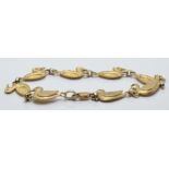 A 9ct gold bracelet made up of duck shaped links set with sapphires, 8g