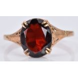 A 9ct gold ring set with an oval garnet, 1.9g, size L