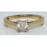 An 18ct gold ring set with a diamond of approximately 0.3ct in an illusion setting, 2.2g, size N