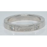 Cartier Lanieres 18ct white gold ring set with two round cut diamonds, 6.2g, size M/N