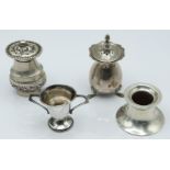 Four hallmarked silver and white metal items comprising pepper, Birmingham 1915, small trophy cup,