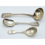 Three Georgian and later fiddle pattern hallmarked silver items of cutlery, two being Irish,